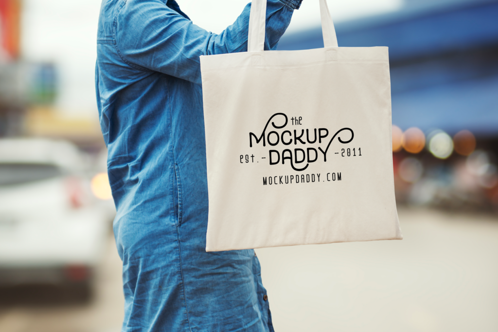 Download Tote Bag in Women Hand Mockup - Mockup Daddy